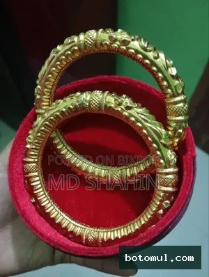 22-carat gold, there is 12 ana of gold. Bala